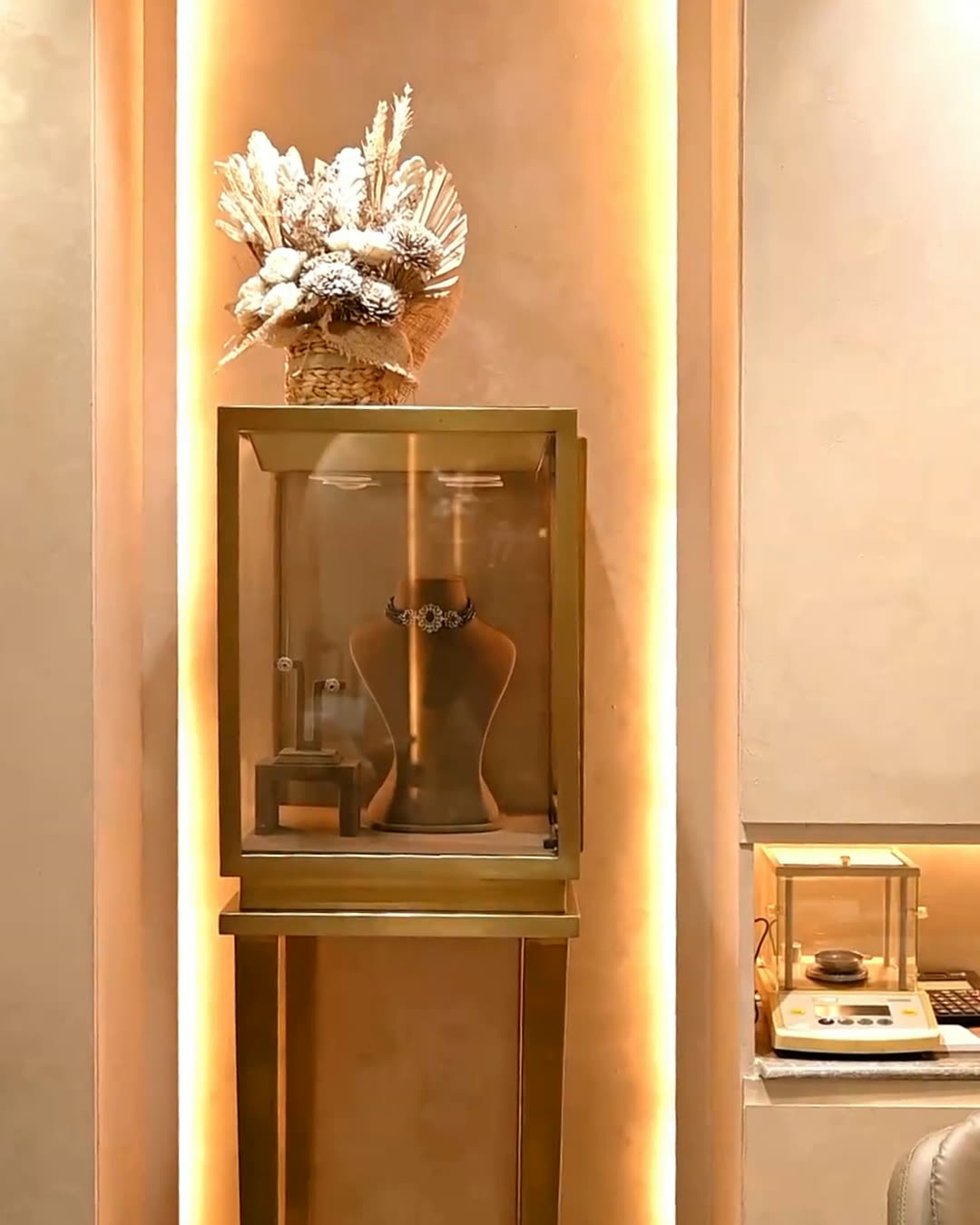 A lit display case in the Shree Balaji Jewellers showroom